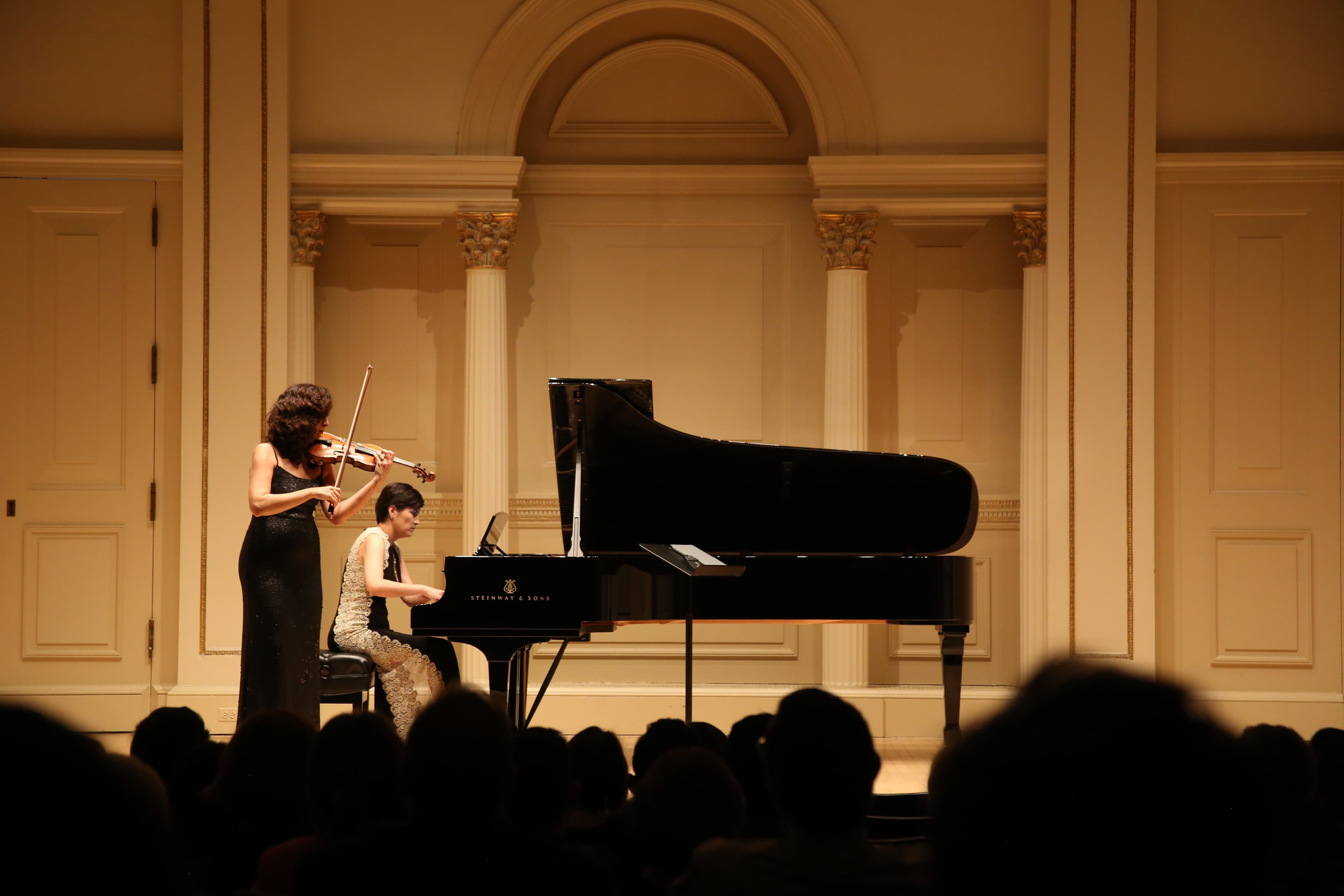 Maya Tuylieva, from Turkmenistan, a concert pianist, and Diana Seitz, from Azerbaijan, perform at Carnegie Hall's Weill Recital Hall in April of 2000 as part of the program, East Meets West. 
